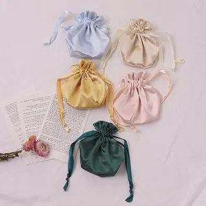 Satin drawstring bags for gifts or cosmetics in five pastel colors on elegant fabric