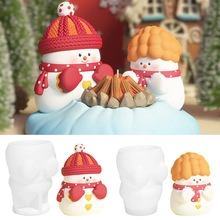 Detail showing translucent silicone snowman molds and finished DIY resin Christmas crafts
