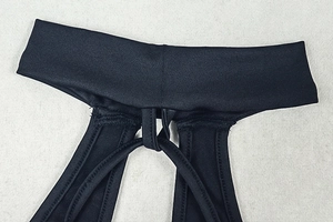 Detailed close-up of the adjustable halter neck straps and seam texture on black bodysuit