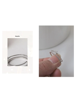 Close-up of S925 sterling silver hallmark on crown layered ring with micro-inlaid diamonds