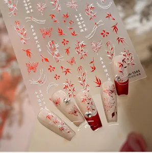 Detail of bamboo leaves and butterfly nail decals with 3D gold embossed texture