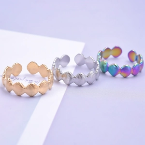 Three-piece set of shell-shaped stainless steel open rings in gold, silver, and rainbow colors