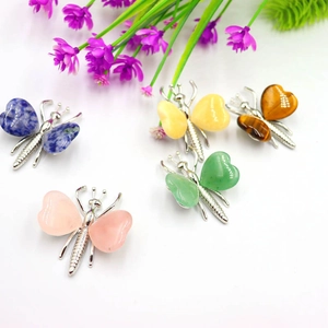 Set of five natural crystal butterfly ornaments with semi-precious stone wings and silver base