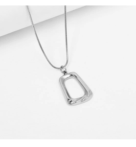 Detail of silver geometric square pendant with sleek snake chain made of stainless steel