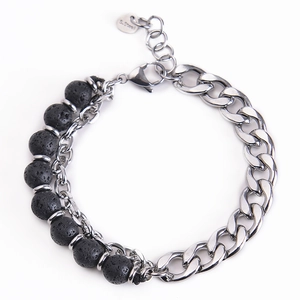 Detail of men's stainless steel bracelet with black volcanic stone beads and lobster clasp