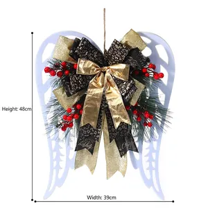 Christmas angel wing wreath with leopard bow, pine cones and red berries decor