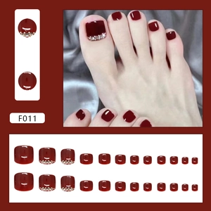 Dark burgundy square press-on toenails set with sparkling rhinestone accents