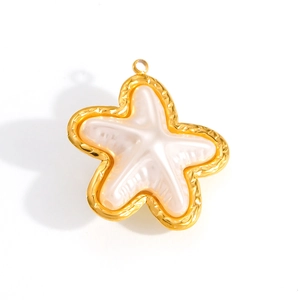 Close-up of a 18k gold starfish pendant featuring elegant white mother of pearl inlay