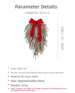 Close-up of frosted pine needles with red berries and a large red bow on a hanging wreath