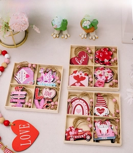 Detail of pink wooden Valentine's heart ornaments in box with jute twine and beads