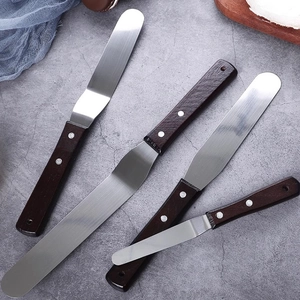 Set of four professional offset and straight stainless steel cake spatulas with rosewood handles