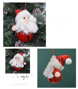 Close-up of Santa Claus plush bell hanging ornament with red metal finish and festive string