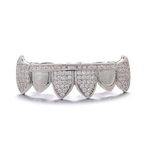 Macro shot of silver hip hop grillz with pavé set sparkling rhinestones and cubic zirconia