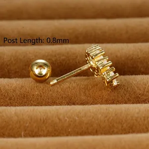 Gold marquise zircon stud earrings with 0.8mm screw back post on brown velvet