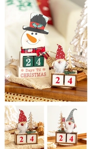 Detail of wooden Christmas countdown calendars featuring snowman and gnome figurines