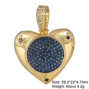 Detailed view of a gold heart pendant with blue zircon pave and star accents