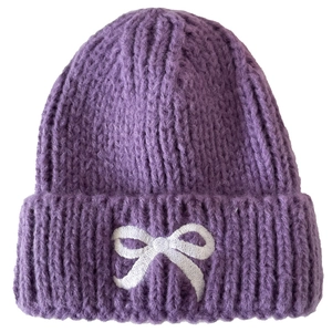 Kids purple knit beanie with white embroidered bow, warm winter wool hat for children