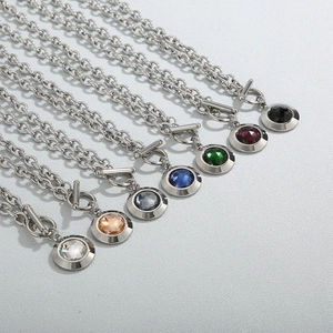 Detailed display of colorful crystal pendants on silver steel chains with OT toggle clasps