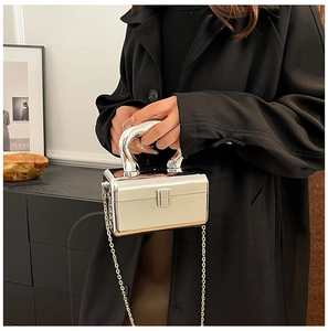 Silver metallic box clutch bag with elegant arc handle and fine metal chain shoulder strap