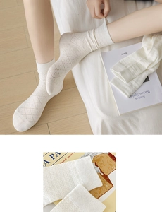 Detail showing white diamond hollow knit pattern and breathable mesh on crew socks