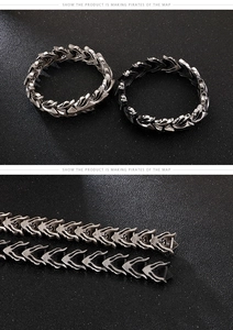 Detailed close-up of retro dragon scale texture on punk style stainless steel bracelet