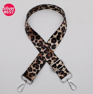 Close-up of leopard print wide adjustable shoulder strap with silver metal hooks
