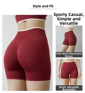 Close-up of red seamless high-waist yoga shorts with white contrast ribbed waistband