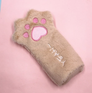 Detail of plush cat paw pencil case with embroidered pink pads and YEAH text