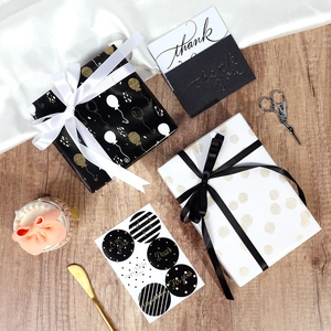 Gift wrapping paper set with balloon patterns ribbons and thank you cards for birthdays