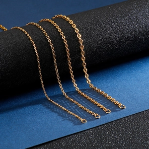 Macro shot of four golden stainless steel cross link chains with polished texture