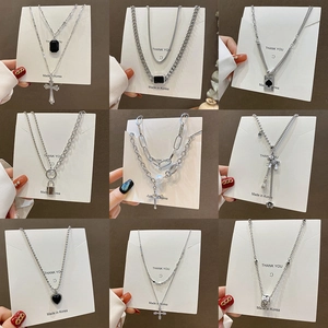 Hip hop silver necklaces with various pendants like cross, heart and pearls on cards