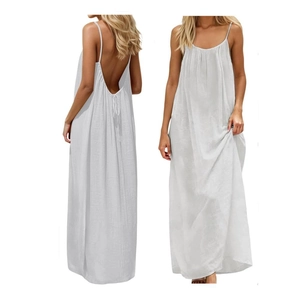 White backless maxi dress with spaghetti straps and pleated hem for beach vacation