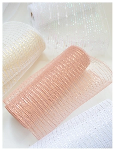 Close-up of metallic deco mesh ribbons in rose gold and silver for Christmas decor