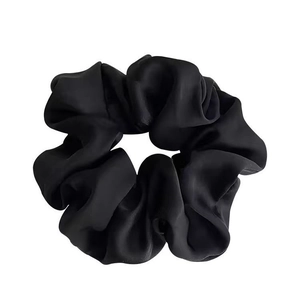 Elegant black satin scrunchie for women with premium glossy texture and pleated design