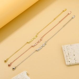 Detailed view of three heart charm necklaces in gold, rose gold and silver finishes