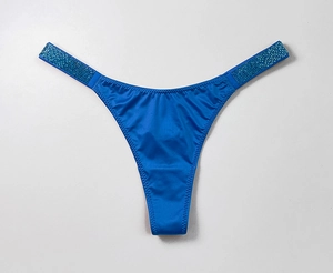 Close-up of bright blue satin thong featuring sparkling rhinestone side straps