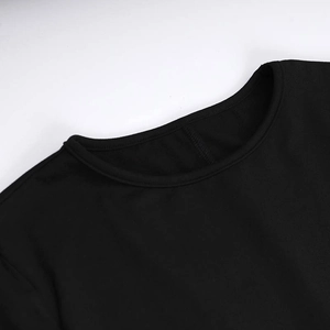 Detailed close-up of the round neckline and smooth stitching on the black dress