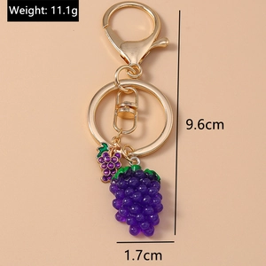 Detail view of purple grape keychain with golden lobster clasp showing 9.6cm length