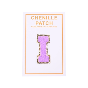 Close-up of purple chenille letter I patch with gold glitter edge and adhesive back