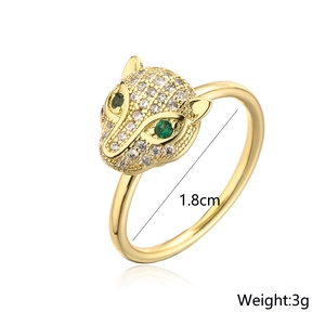 Detail shot of rotatable 18K gold plated leopard head ring with green zircon eyes
