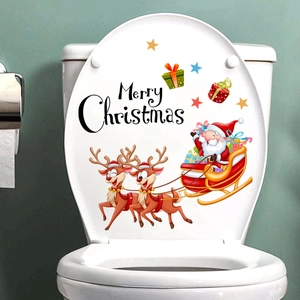 Merry Christmas themed toilet lid decal featuring Santa, reindeer and stars on white background