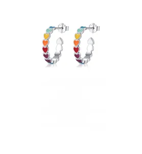 Close-up of S925 sterling silver hoop earrings with colorful rainbow enamel heart patterns