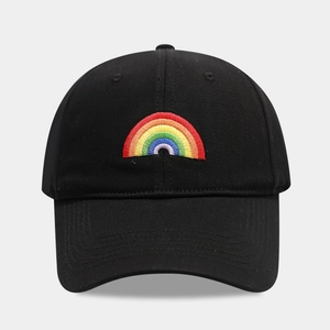 Close-up of rainbow embroidery detail on a vintage washed black cotton baseball cap