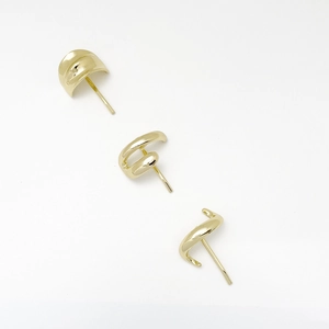 Detailed view of three gold minimalist geometric alloy earrings in polished finish