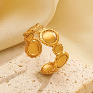 Minimalist gold-plated stainless steel open ring with textured circular geometric motifs