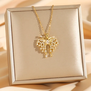 Elegant gold butterfly pendant necklace with shimmering zircon crystals in a luxury box