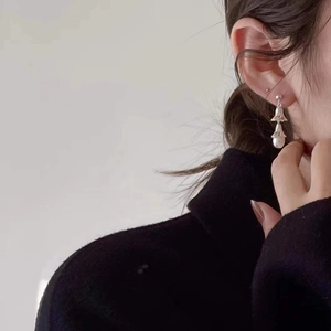 925 silver irregular pearl drop earrings worn by model with minimalist design