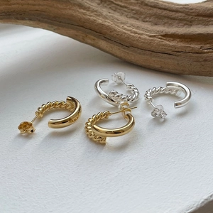 Detail of S925 sterling silver hoop earrings with half-twisted and half-smooth texture