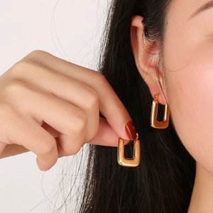 Polished gold U-shaped chunky hoop earrings for women featuring a minimalist geometric design