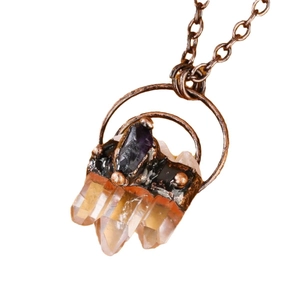 Vintage necklace featuring white quartz pillars and purple amethyst pendant on bronze chain